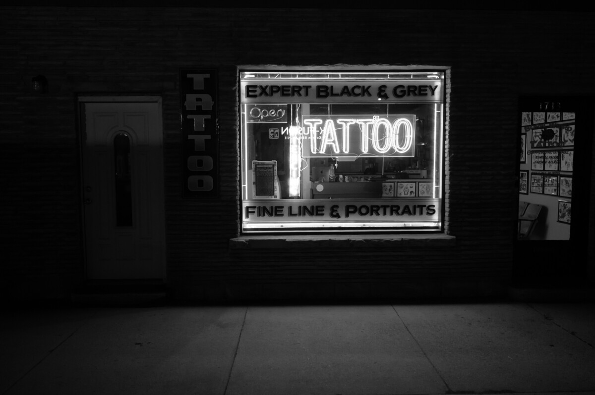 Exterior view of a well-organized tattoo studio featuring sterilized equipment and vibrant art displays.